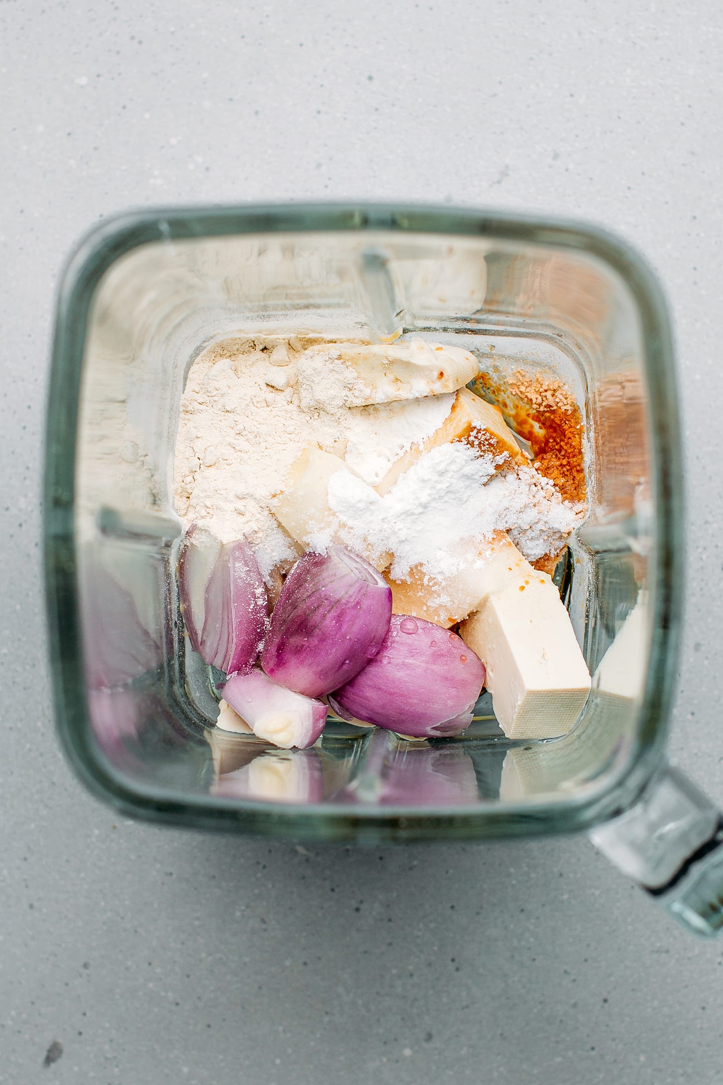 Tofu, shallots, water, and salt in a blender.