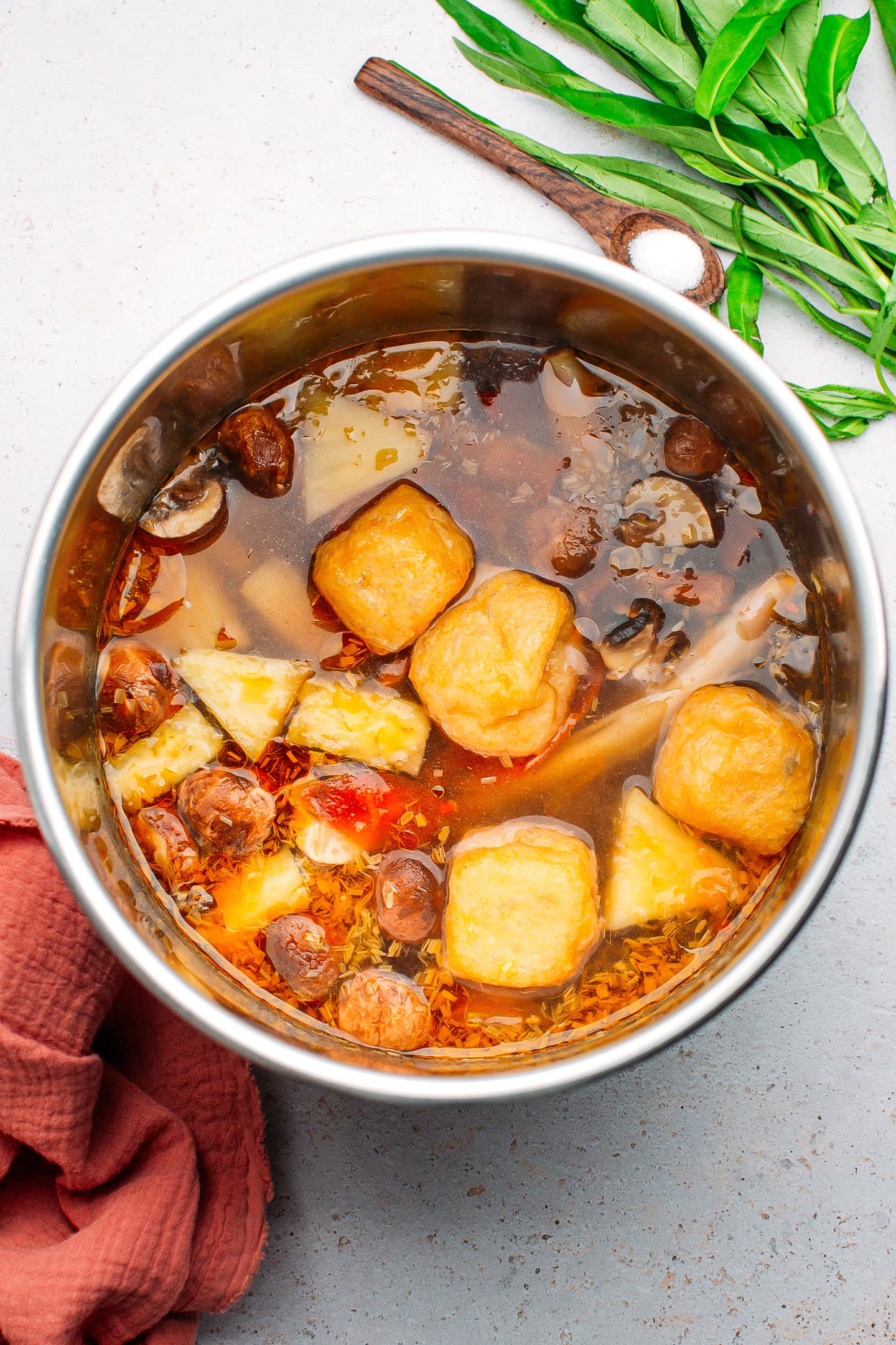 Sweet and sour broth in a pot.