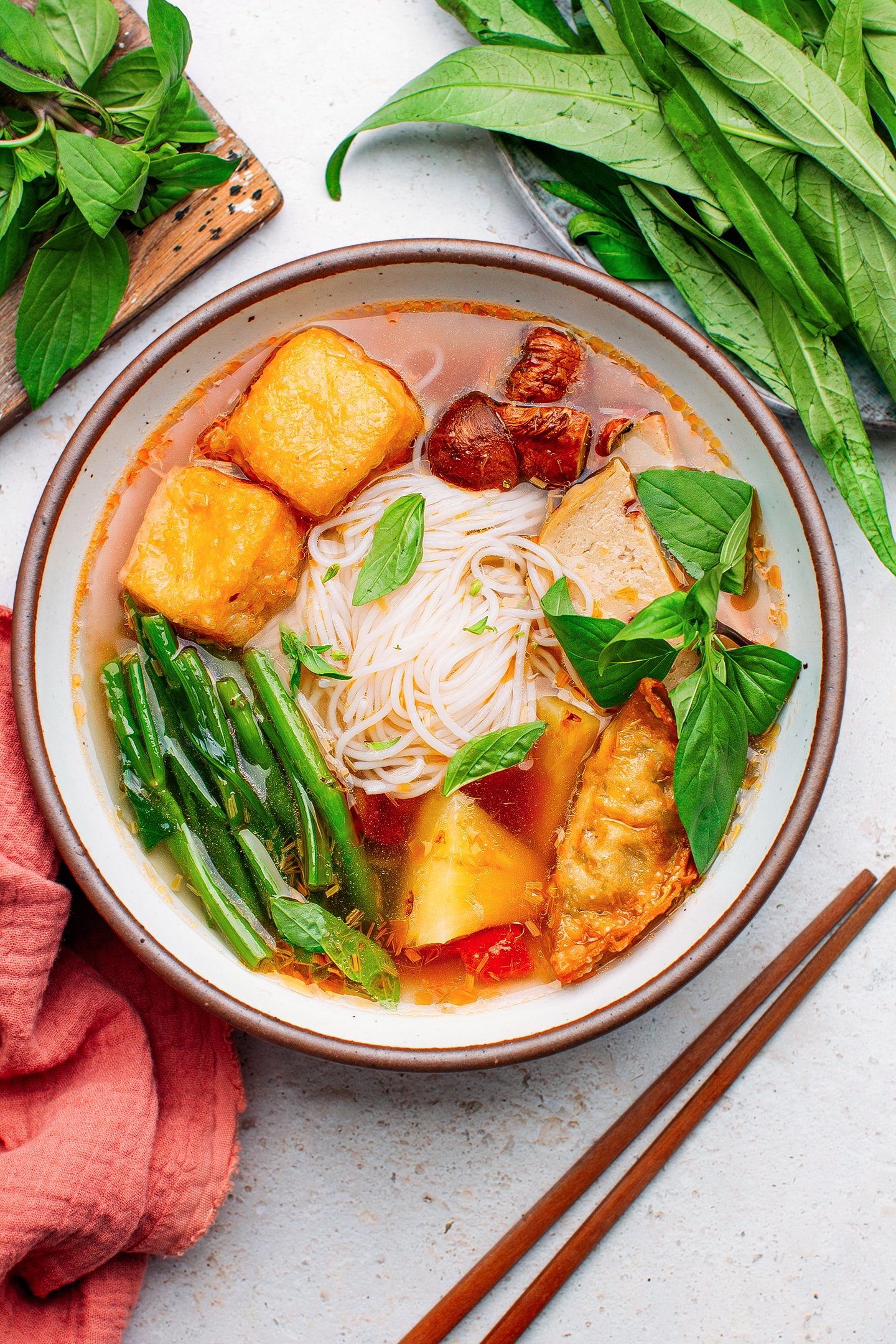 Vegan hot and sour soup with pineapple, tofu, morning glory, and bologna.