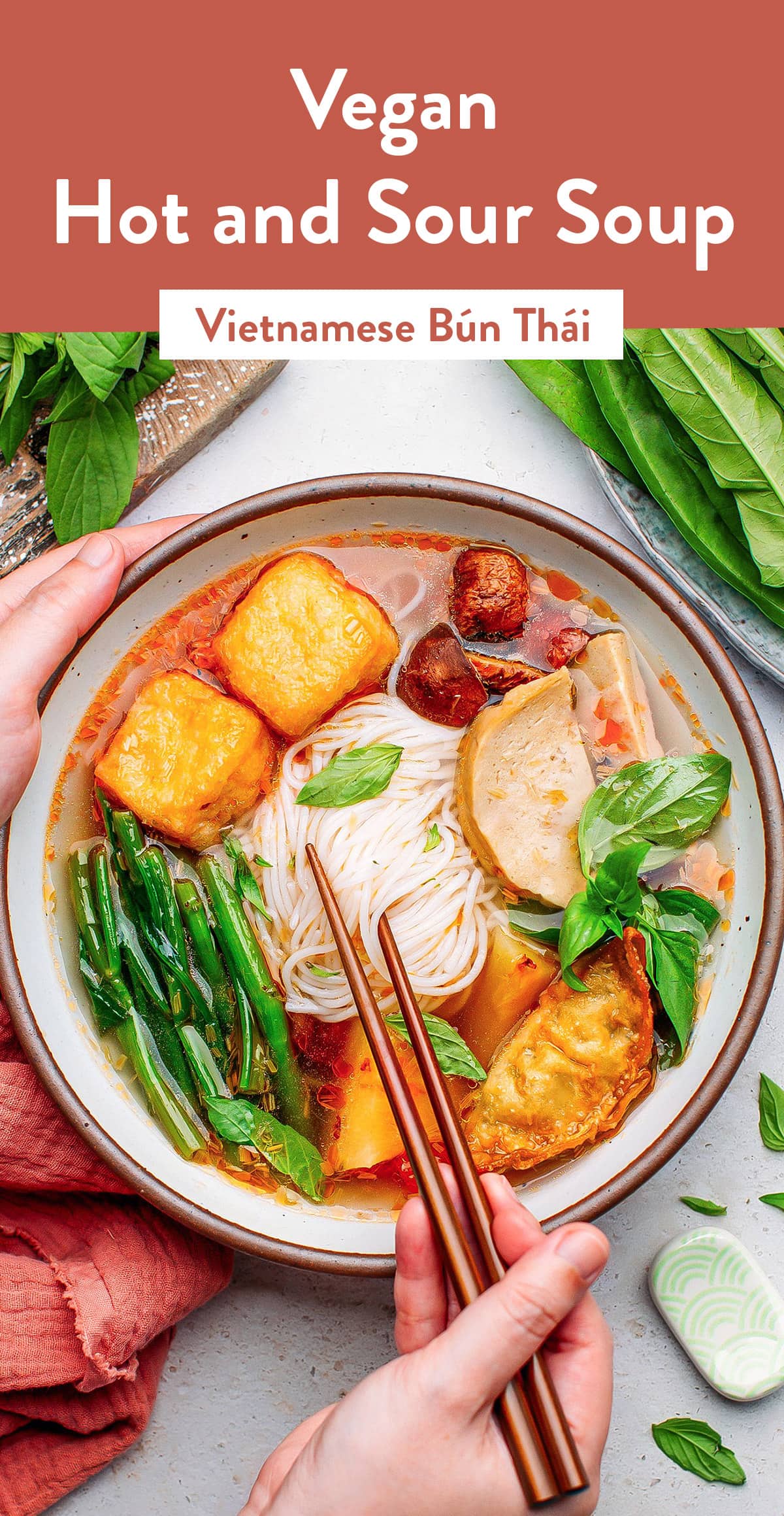 This vegan hot and sour soup is infused with lemongrass, tamarind juice, and pineapple for a wonderful harmony of sweet, sour, and spicy flavors. Served with rice noodles, fried tofu, and plenty of greens, this is one of our favorite Vietnamese noodle soups! #vietnamese #noodlesoup
