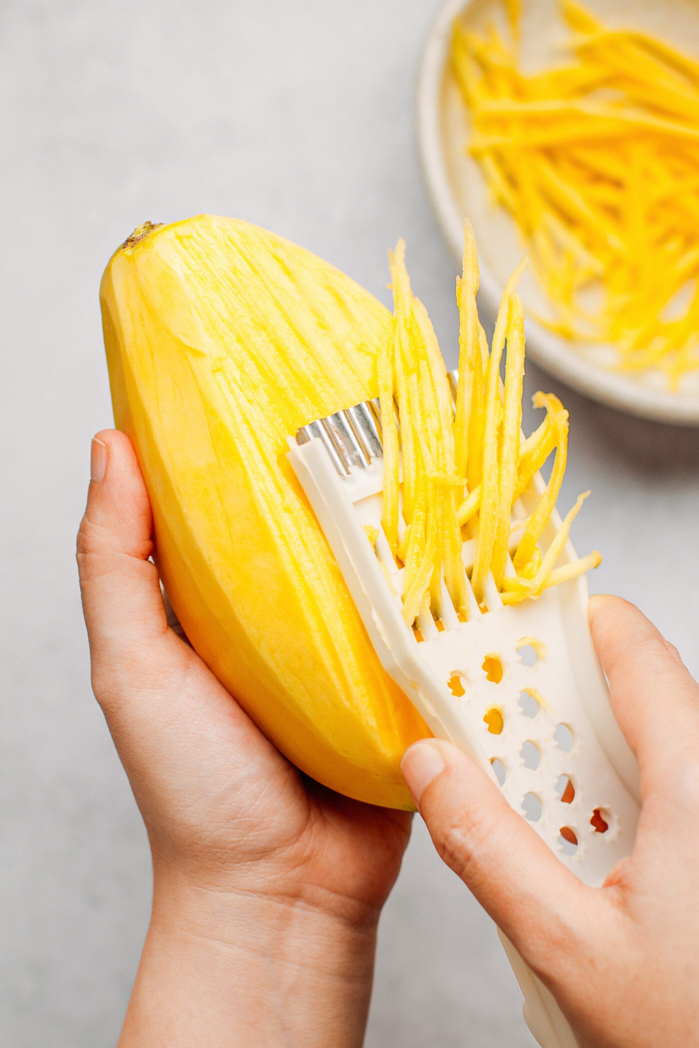 Grating green mango.