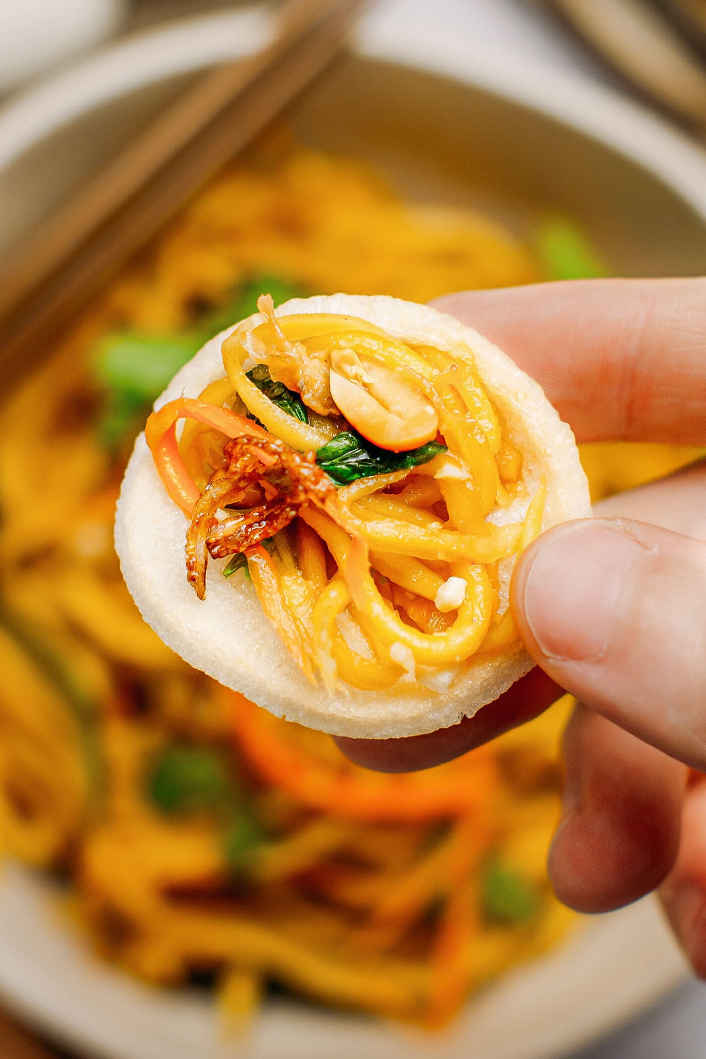 Close up of green mango salad on a chip.