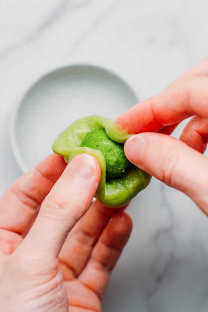 Wrapping matcha mochi.