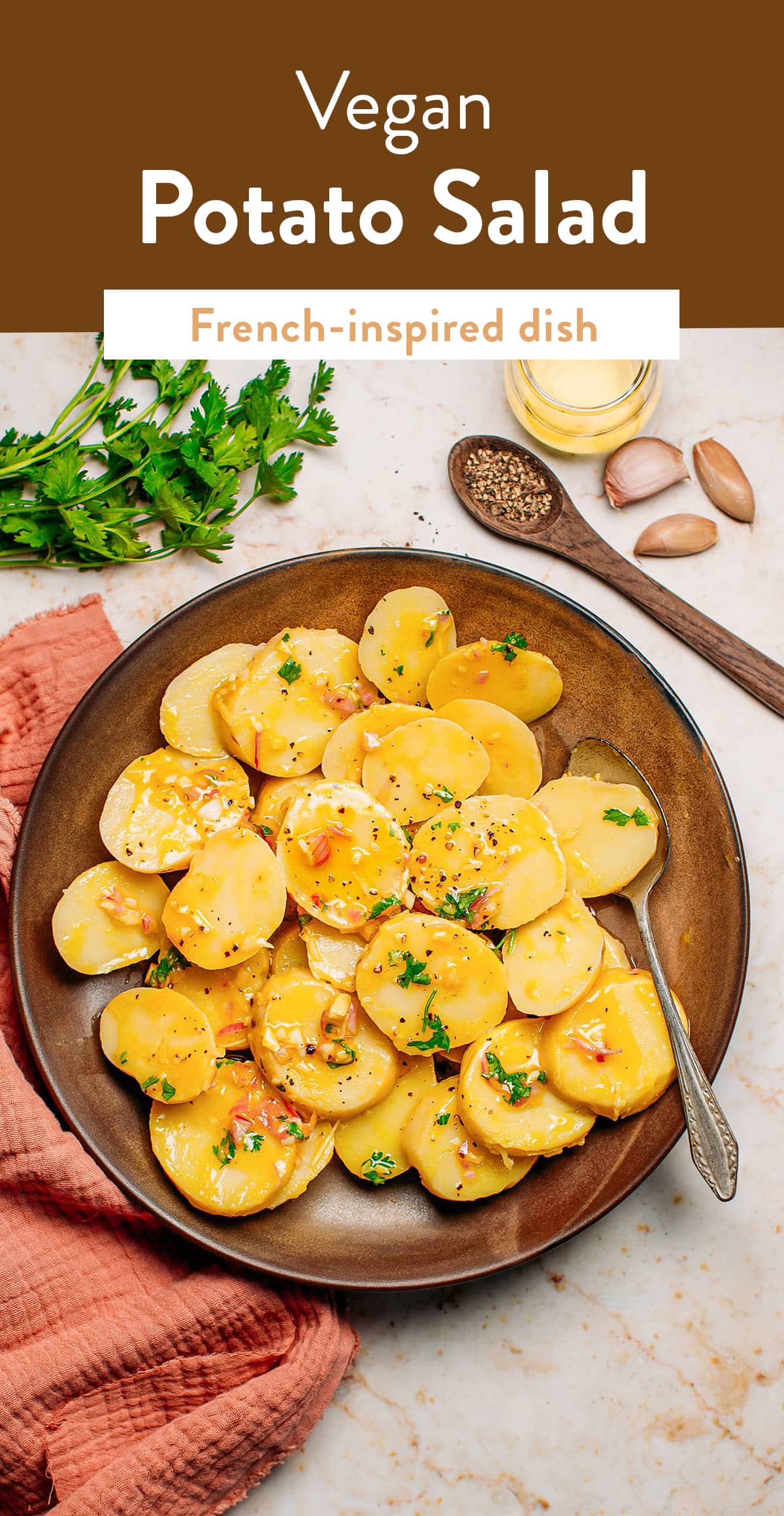 This simple French-inspired vegan potato salad is prepared with baby potatoes and comes with a garlicky homemade vinaigrette! It takes less than 30 minutes and just 7 ingredients. A hearty and flavorful plant-based appetizer! #potatosalad #vegan #plantbased