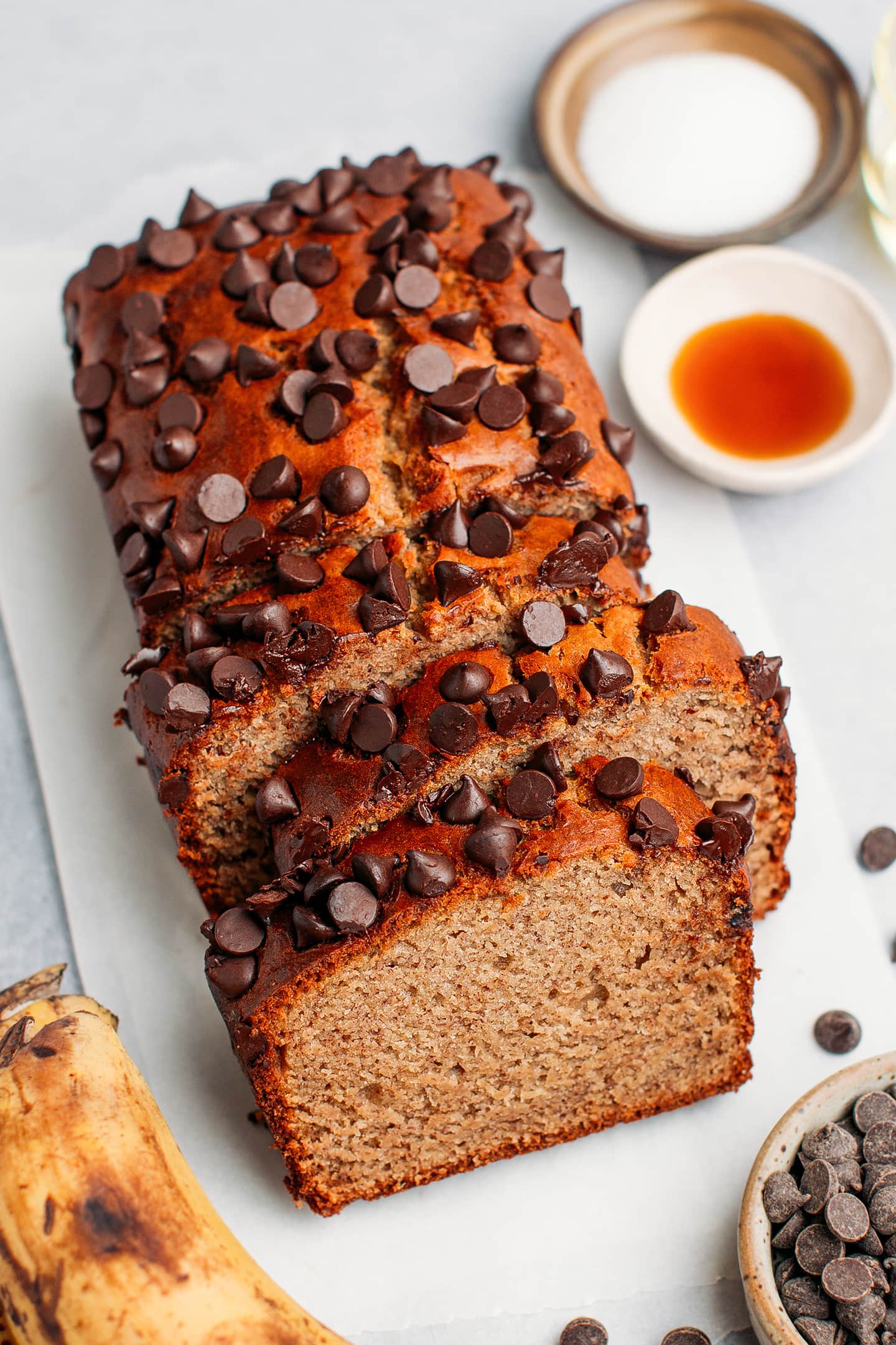 Sliced banana bread topped with chocolate chips.