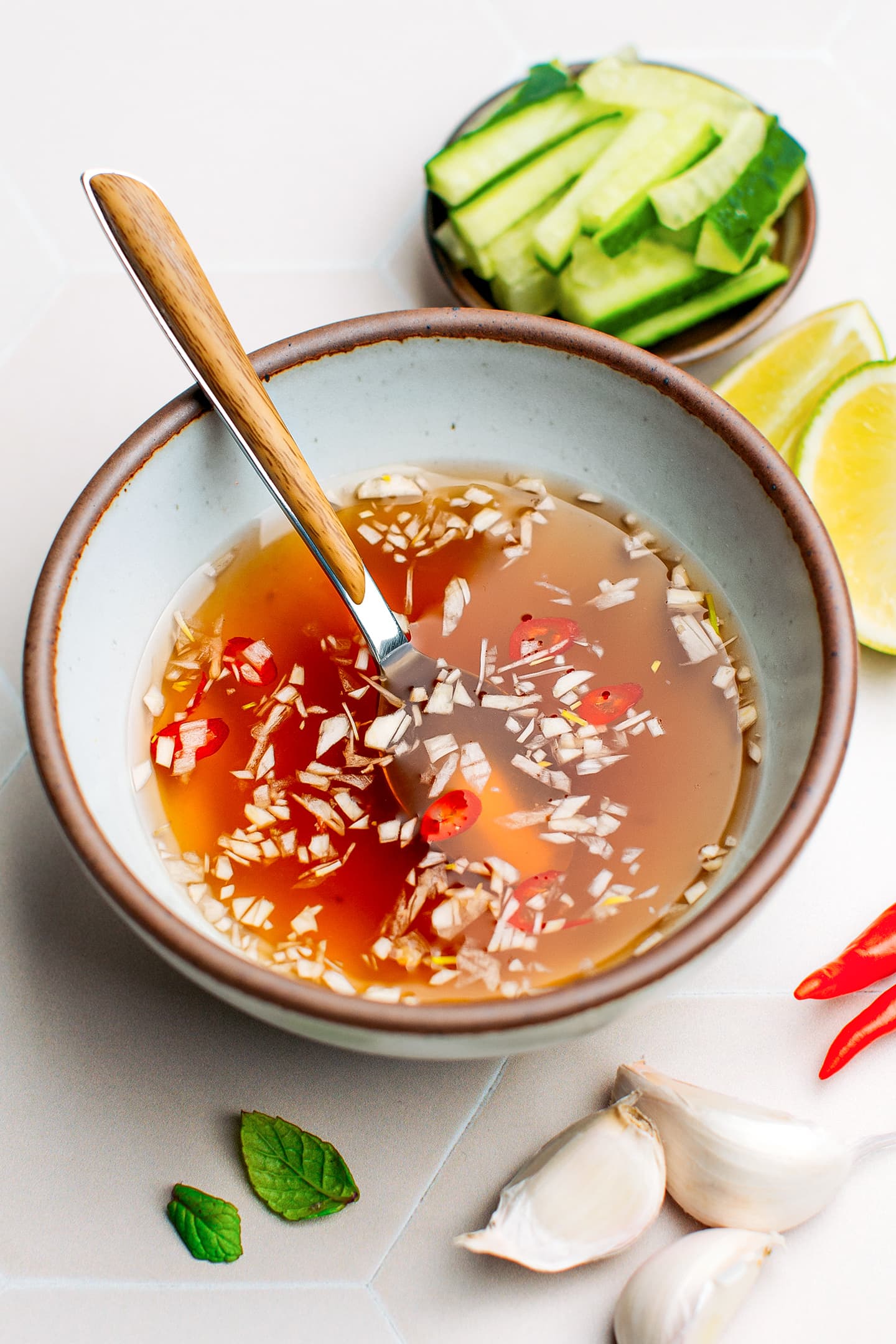 Vietnamese dipping sauce with garlic and chili in a bowl.