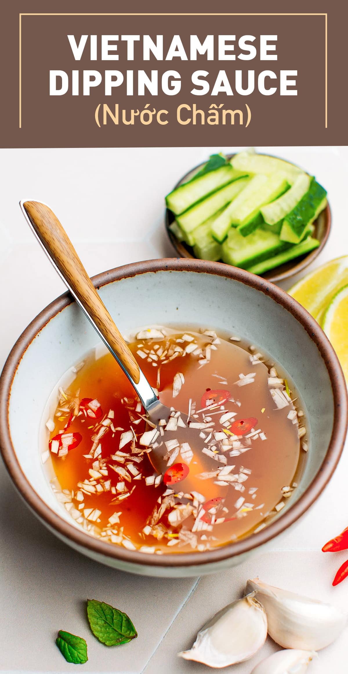 Nước Chấm is a classic Vietnamese dipping sauce that is sweet, salty, tangy, and garlicky! This plant-based version uses vegan fish sauce, lime juice, sugar, garlic, and chili, resulting in a wonderful blend of flavors. It perfectly accompanies fresh spring rolls, bánh xèo, egg rolls, salads, and so much more! #vietnamese #sauce