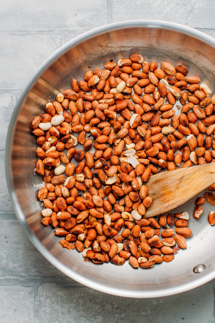 Toasted peanuts in a skillet.